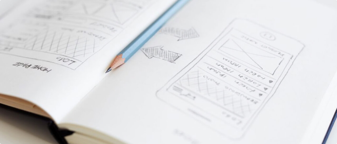A notebook showing sketches of an app design