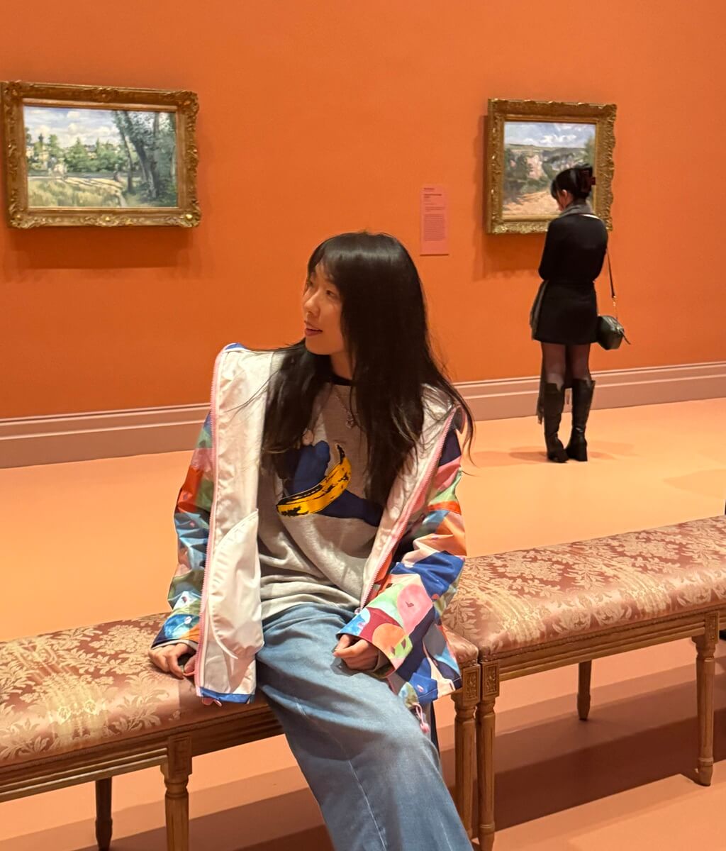 Emma Zhang sitting in an art gallery