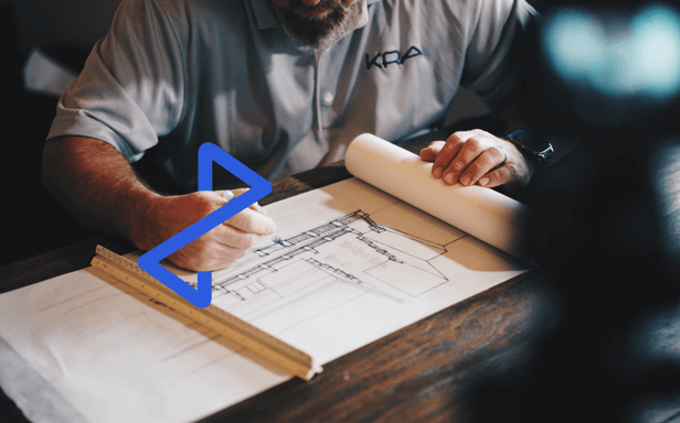 Architect looking at building diagram overlaid with Tradex branding