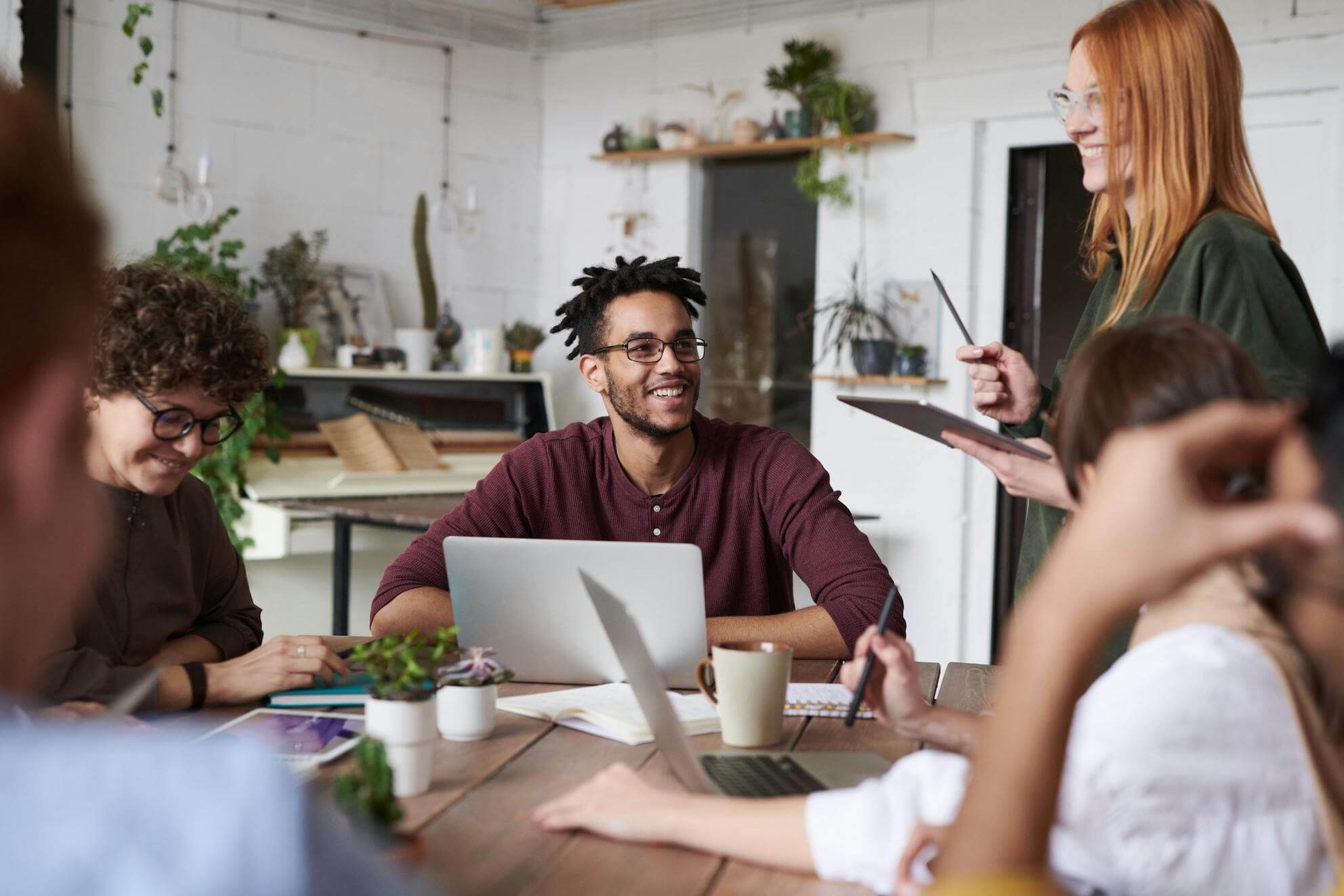 People smiling and working together - great people are behind successful apps.